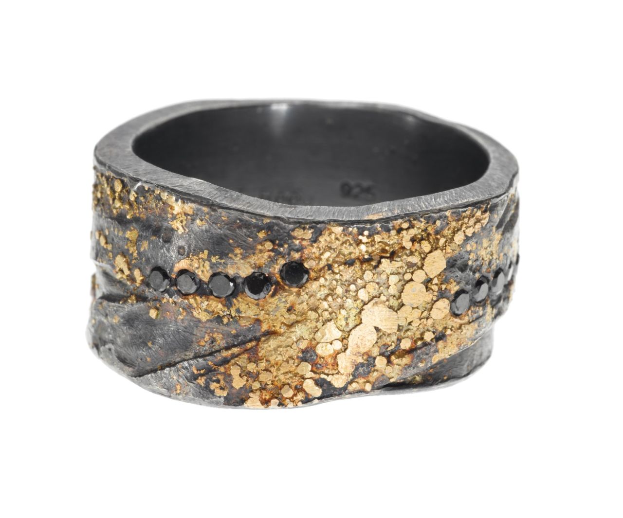 "This sterling silver and 22-karat gold band is hand fabricated by layer pieces of metal and hammering to create the texture of the band. It is a nice symbol of two people coming together to create a life together." -- Todd Reed, CEO of<a href="http://toddreed.com/" target="_blank" target="_blank"> Todd Reed </a>