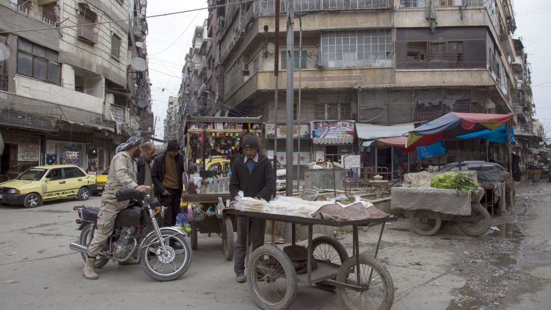 Residents shot at a city market in Aleppo. 