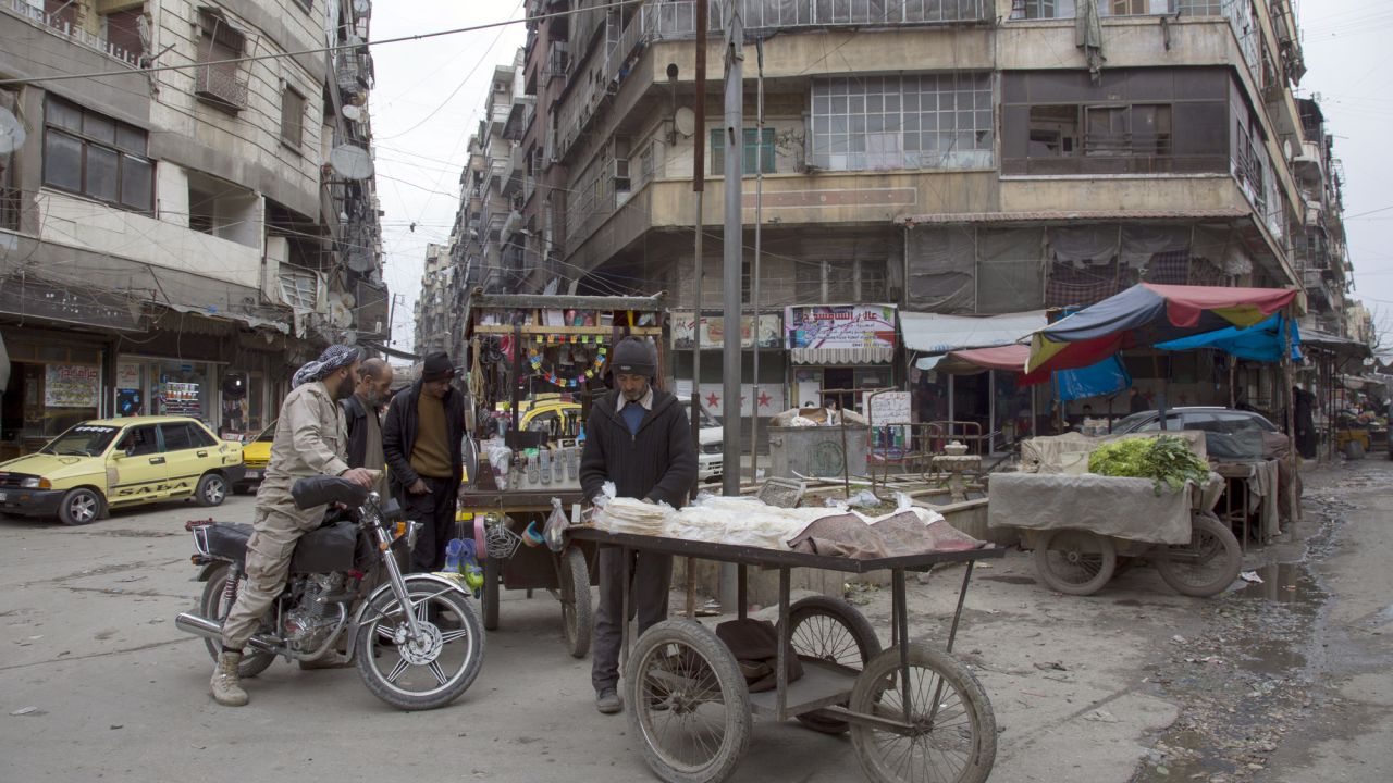 Residents shot at a city market in Aleppo.
