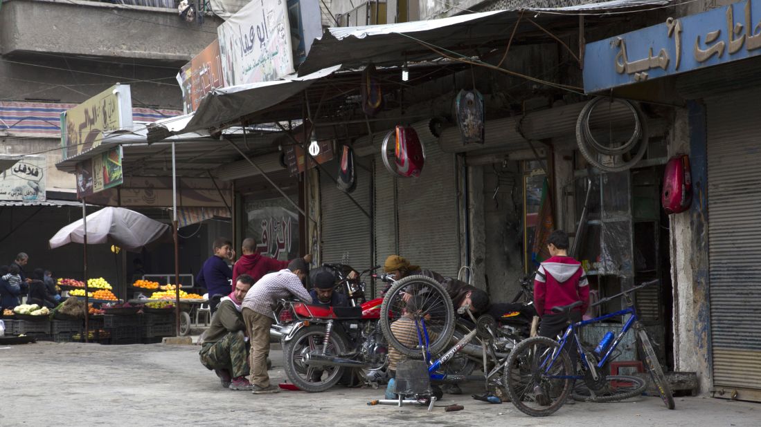 Residents in the Syrian city of Aleppo appear to enjoy an unusually calm and peaceful day as a temporary ceasefire takes effect.