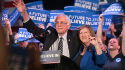 US Democratic presidential candidate Bernie Sanders and his wife Jane wave after he addressed a rally at the Township Auditorium in Columbia, South Carolina, on February 26, 2016.