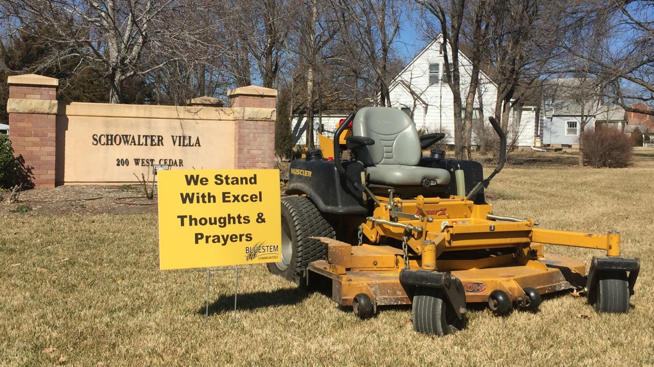 Along with the mowers, residents posted signs of support. 