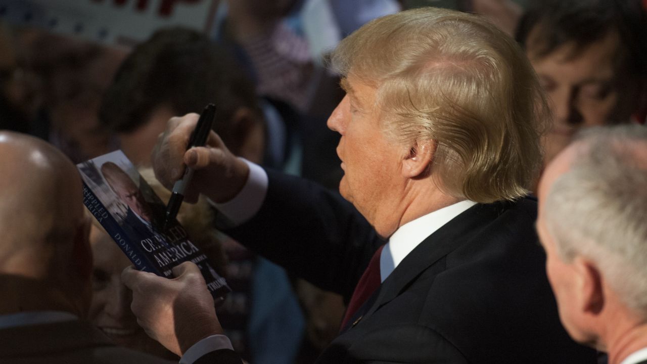 Republican Presidential candidate Donald Trump signs autographs for supporters at the conclusion of a Donald Trump rally at Millington Regional Jetport on February 27, 2016 in Millington, Tennessee.  / AFP / Michael B. Thomas        (Photo credit should read MICHAEL B. THOMAS/AFP/Getty Images)