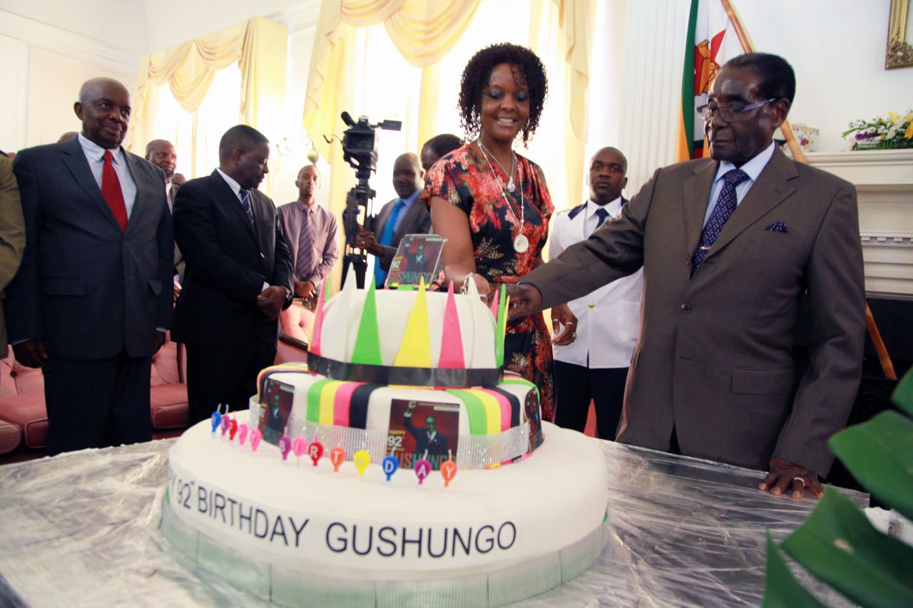 Mugabe and his wife cut a second cake at State House with his office staff on February 22, 2016.