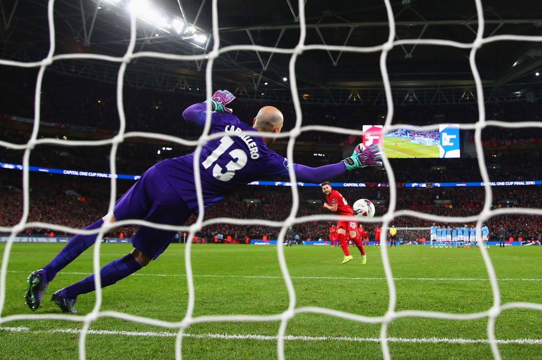 Willy Caballero saves a penalty from Adam Lallana of Liverpool as his side won the shootout 3-1 to win the final. 