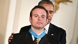 US President Barack Obama presents Navy Senior Chief Edward Byers with the Medal of Honor during a ceremony in the East Room of the White House February 29, 2016 in Washington, DC.