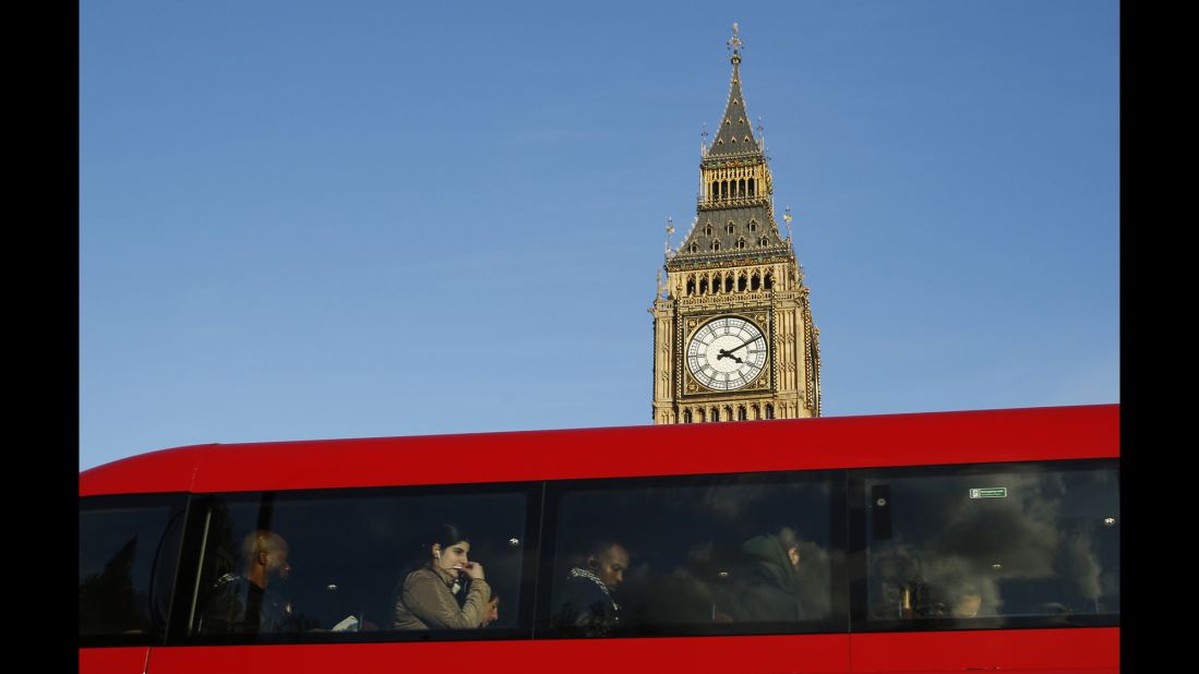 Two London icons: a red double-decker bus and Big Ben bell tower at the Palace of Westminster, the UK's seat of government. 