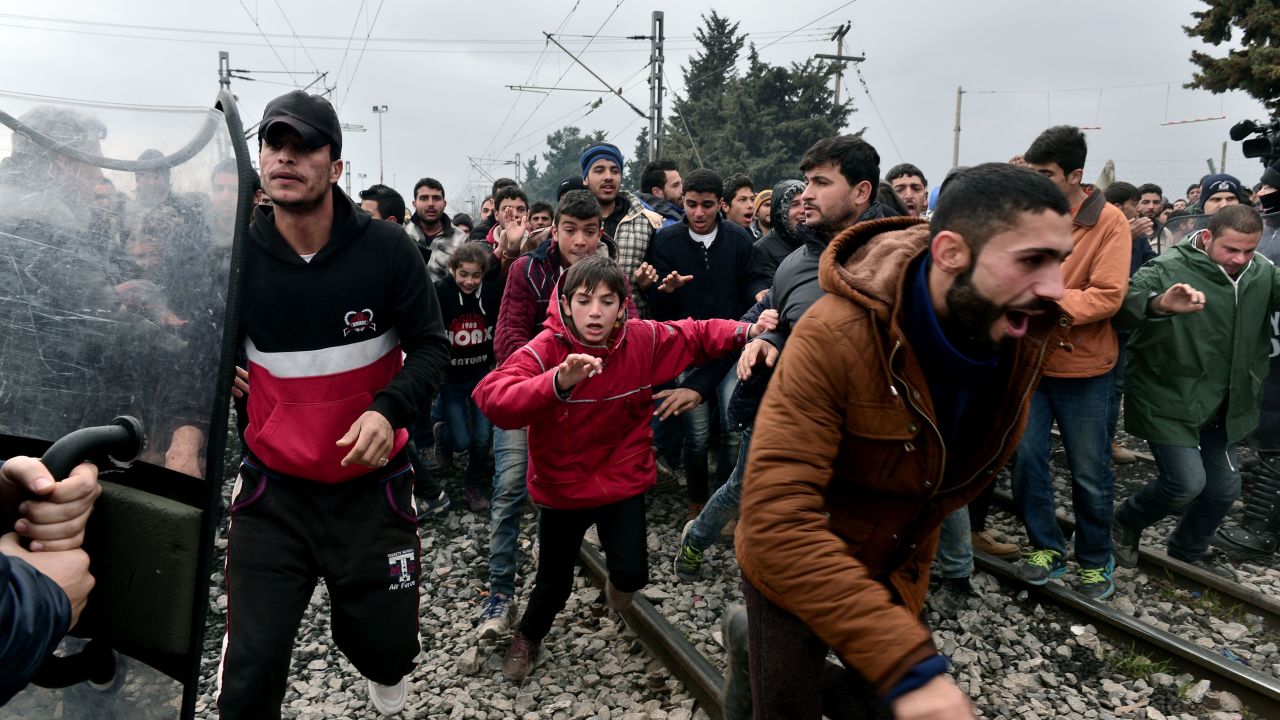 Migrants break through a blockade near the Greek-Macedonian border.