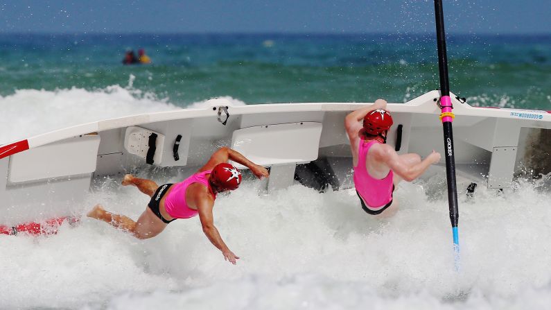 A surfboat tips over during the Piha Big Wave Classic, which took place in Auckland, New Zealand, on Saturday, February 27.