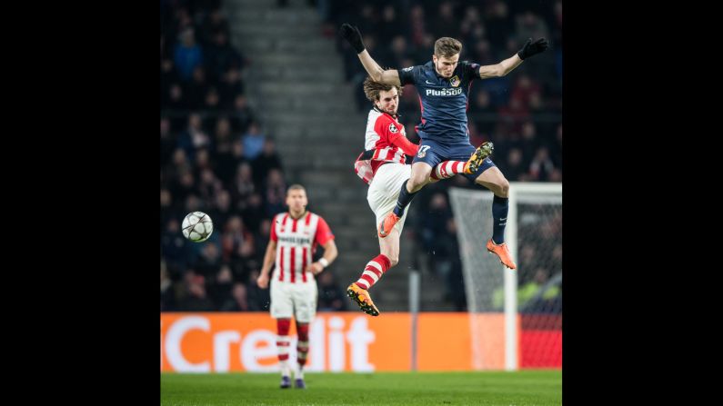 PSV's Davy Propper challenges Atletico Madrid's Saul Niguez during a Champions League match in Eindhoven, Netherlands, on Tuesday, February 24.