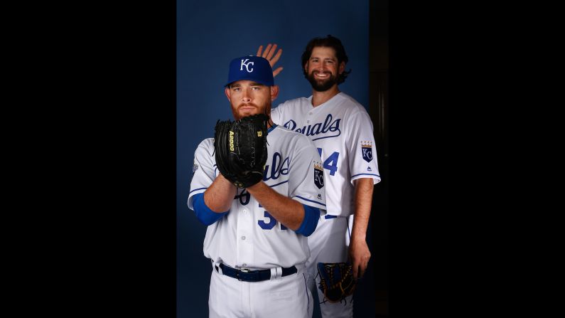 Luke Hochevar crashes Ian Kennedy's portrait during spring training photo day on Wednesday, February 25. Both play for the Kansas City Royals, who won the World Series last year.