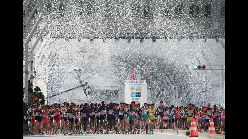 Runners start the Tokyo Marathon in front of confetti on Sunday, February 28.
