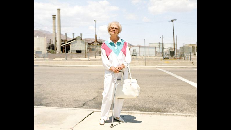 Alice Jones stands outside a mineral processing facility in Trona, California. More than 100 years ago, Trona was designed to house the workforce of a mining company. Its population, which once peaked at around 7,000, has now dropped to about 1,000, photographer Ewan Telford said.