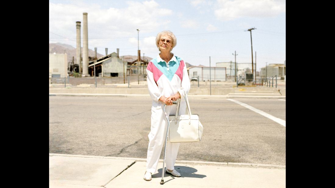 Alice Jones stands outside a mineral processing facility in Trona, California. More than 100 years ago, Trona was designed to house the workforce of a mining company. Its population, which once peaked at around 7,000, has now dropped to about 1,000, photographer Ewan Telford said.