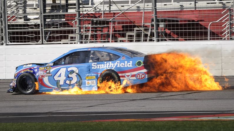 Aric Almirola's Sprint Cup car catches fire after a last-lap crash at Atlanta Motor Speedway on Sunday, February 28. He was OK.