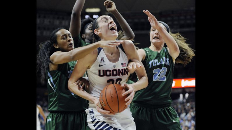 UConn's Breanna Stewart is swarmed by Tulane defenders during a game in Storrs, Connecticut, on Saturday, February 27. Stewart and the Huskies are undefeated this season as they seek their fourth straight national title.
