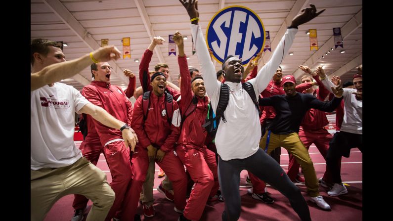 Track athletes from the University of Arkansas celebrate after they won the SEC indoor championships on Saturday, February 27. It is the 100th conference title in program history.