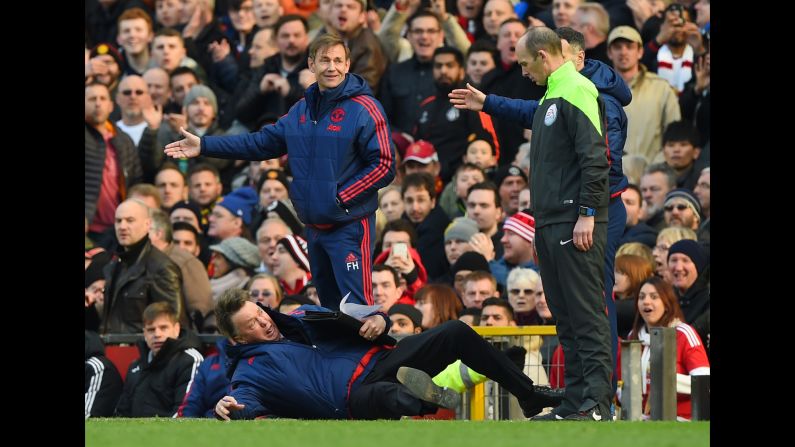 Louis van Gaal, the manager of Manchester United, <a href="index.php?page=&url=http%3A%2F%2Fbleacherreport.com%2Farticles%2F2620431-manchester-united-vs-arsenal-louis-van-gaal-arsene-wenger-post-match-reaction" target="_blank" target="_blank">throws himself to the ground</a> as he makes a point to the fourth official in Manchester, England, on Sunday, February 28.