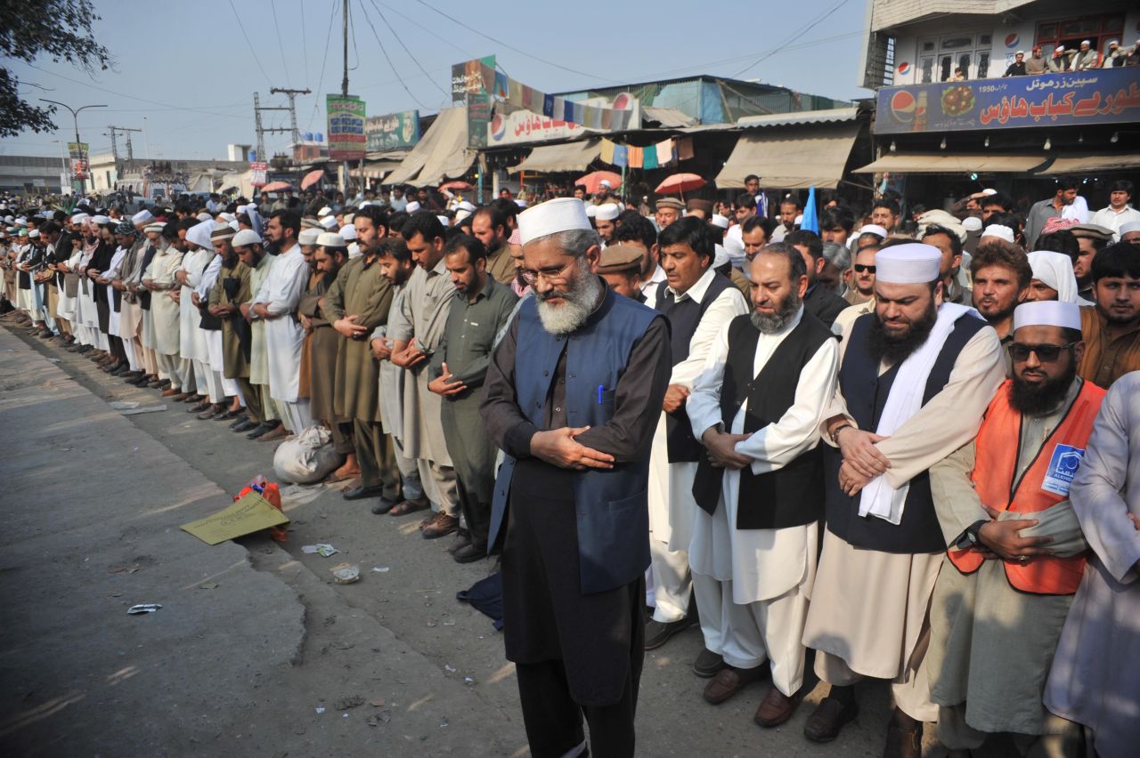 Pakistani political and Islamic party Jammat-e-Islami (JI) chief Siraj-ul-Haq (front) offers funeral prayers for  Qadri following his execution on February 29, 2016.