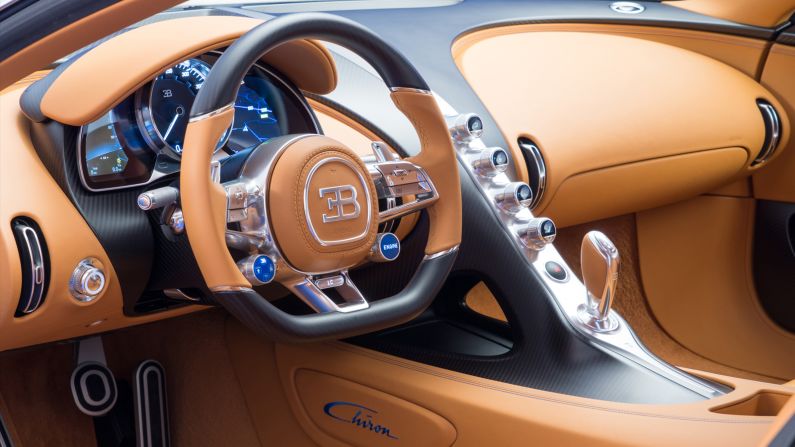 The cockpit layout of the Bugatti Chiron has a seven-speed dual-clutch gearbox. Produced from the most exclusive materials available, all aluminium parts are milled from solid material.