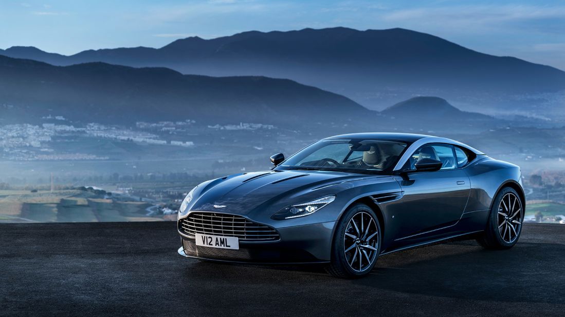 The brutally powerful V12 petrol engine sits underneath the sweptback bonnet and behind the Aston's trademark radiator grille.