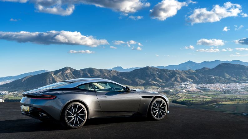 The DB11 draws on a variety of aerodynamic tricks, including what Aston Martin call a "curlicue," a curve beyond the front wheels, and an "Aeroblade," an air channel beyond the door that ends below the boot lid, both creating downforce to keep the car firmly planted around corners.