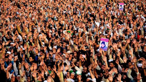 People gather Tuesday for funeral prayers for Qadri in Rawalpindi.