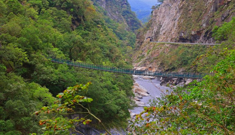 Suspension bridges zigzag across Taroko Gorge. This one requires a permit to cross. Many are not in use at all, thanks to damage from typhoons as well as natural wear. <br />
