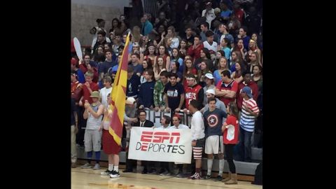 Fans of Andrean High School held up a sign that reads "ESPN deportes" and a poster of Donald Trump at a game in Merrillville, Indiana on Friday.