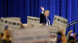 Republican presidential candidate Donald Trump waves as he steps on stage to speak at a rally Tuesday, March 1, 2016, in Louisville, Ky. (AP Photo/John Bazemore)