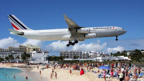 This photo of an Air France Airbus A340 flying into Princess Juliana International Airport was taken at St. Maarten's Maho Beach.