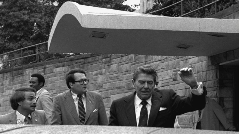 <strong>President Reagan is shot:</strong> In this Pulitzer Prize-winning photo by Associated Press photographer Ron Edmonds, U.S. President Ronald Reagan <a href="index.php?page=&url=http%3A%2F%2Fwww.cnn.com%2F2011%2FPOLITICS%2F03%2F30%2Fhinckley.presidential.protection%2F" target="_blank">is shot</a> in the left side while leaving the Washington Hilton Hotel on March 30, 1981. The Secret Service rushed Reagan to George Washington University Hospital, where he underwent surgery and recovered. The shooter, <a href="index.php?page=&url=https%3A%2F%2Fwww.washingtonpost.com%2Flocal%2Fattorneys-for-john-hinckley-jr-argue-for-his-full-time-release%2F2015%2F04%2F22%2Ff3bb01a6-e901-11e4-9a6a-c1ab95a0600b_story.html" target="_blank" target="_blank">John W. Hinckley Jr.</a>, was later found not guilty by reason of insanity.