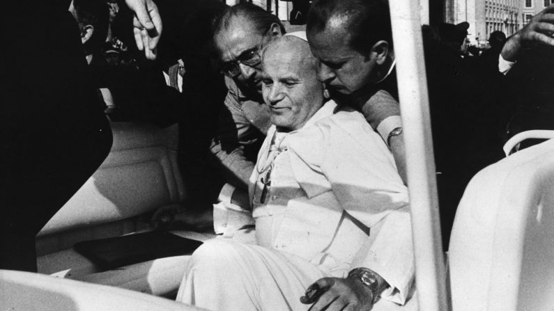 <strong>Assassin targets Pope:</strong> Pope John Paul II collapses into the arms of his aides on May 13, 1981, after an <a href="index.php?page=&url=http%3A%2F%2Fwww.nytimes.com%2Flearning%2Fgeneral%2Fonthisday%2Fbig%2F0513.html%23article" target="_blank" target="_blank">assassination attempt</a> by Turkish terrorist Mehmet Ali Agca in St. Peter's Square. Struck by two bullets that hit his abdomen, right arm and left hand, the Pope was seriously wounded and underwent more than five hours of surgery to save his life. Agca went on to <a href="index.php?page=&url=http%3A%2F%2Fwww.theguardian.com%2Fworld%2F2010%2Fjan%2F18%2Fpope-john-paul-mehmet-agca" target="_blank" target="_blank">serve 19 years</a> in an Italian prison. The Pope pardoned Agca in 1983 and worked for his eventual release.