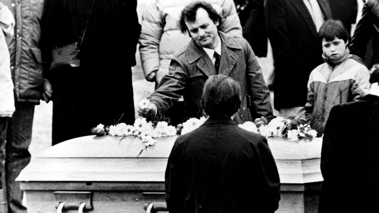 <strong>Farewell to a funnyman:</strong> Actor Bill Murray puts a flower on John Belushi's coffin on March 9, 1982. Belushi, a beloved comedian and former "Saturday Night Live" star, <a href="http://www.nytimes.com/1982/03/06/obituaries/john-belushi-manic-comic-of-tv-and-films-dies.html" target="_blank" target="_blank">died of a drug overdose</a> at the age of 33.