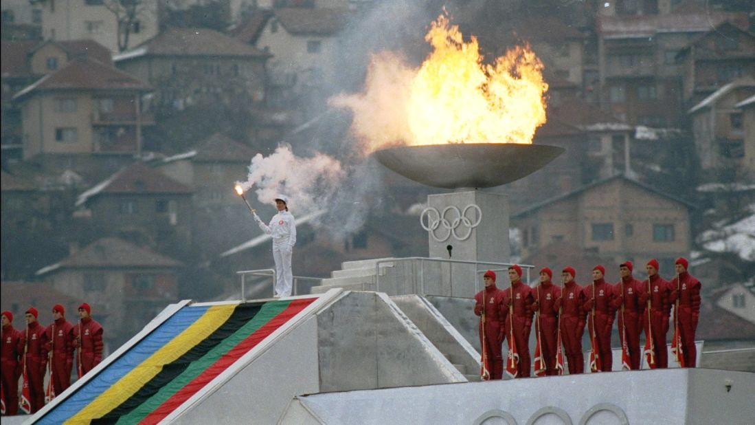 <strong>Carrying the torch:</strong> Yugoslavian figure skater Sanda Dubravcic lights the <a href="http://www.olympic.org/Assets/OSC%20Section/pdf/QR_Torches_Relays_WOG_Oslo_%201952_Sochi%202014.pdf" target="_blank" target="_blank">Olympic flame</a> in Sarajevo's Kosevo stadium during the opening ceremonies of the Winter Olympics in 1984.
