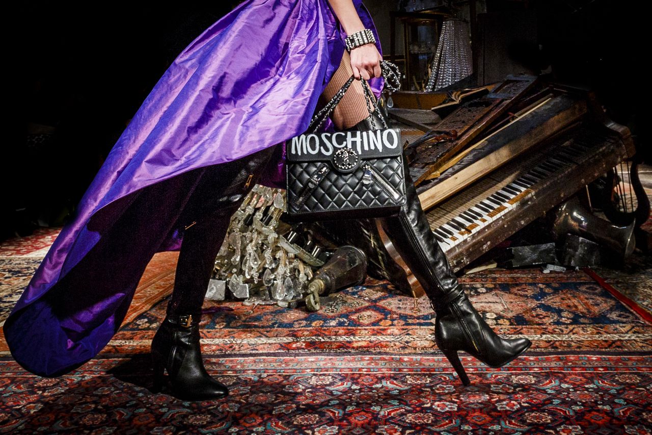 Moschino's Autumn-Winter 2016 collection began with a series of biker-chick chic looks featuring plenty of black leather and dramatic capes. 