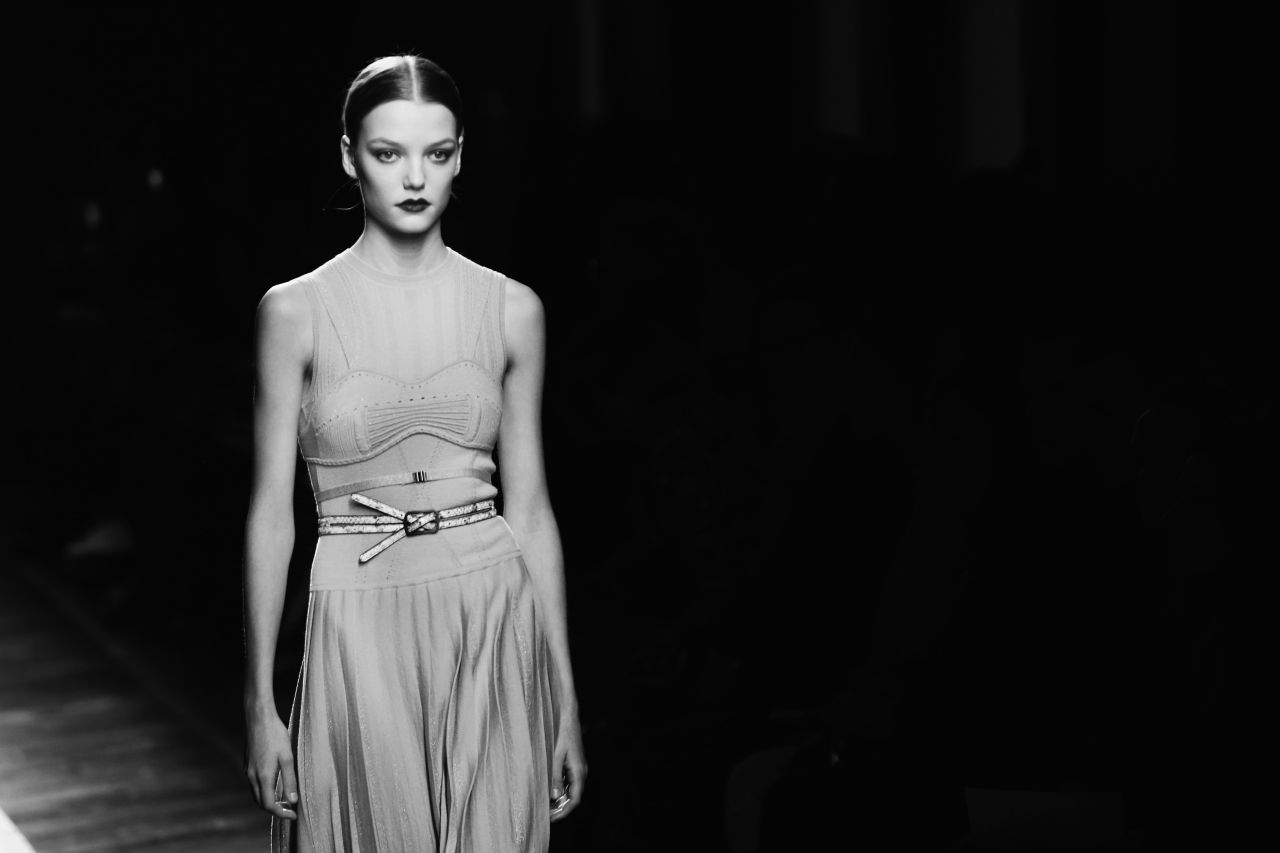 Dresses featured corset details and pleated skirts. 