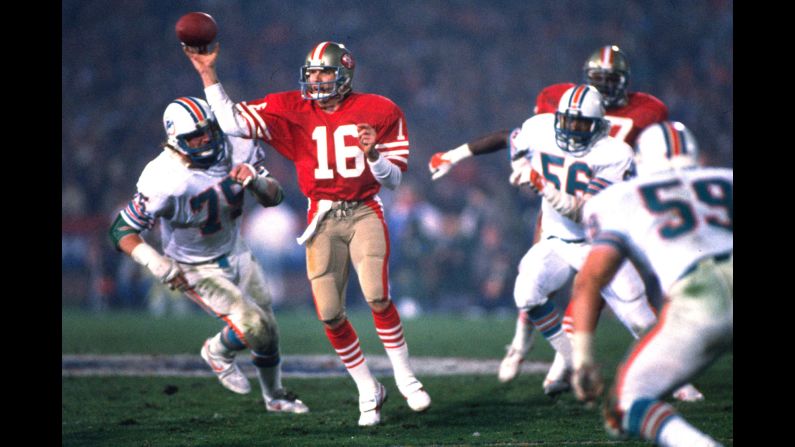 <strong>Not your average Joe:</strong> San Francisco 49ers quarterback Joe Montana handles the ball under pressure in his team's Super Bowl win over Miami on January 20, 1985. Montana was named the game's most valuable player after setting several <a href="index.php?page=&url=http%3A%2F%2Fwww.washingtonpost.com%2Fwp-srv%2Fsports%2Fnfl%2Flongterm%2Fsuperbowl%2Fstories%2Fsb19.htm" target="_blank" target="_blank">records</a> in that game, including 331 yards passing. Montana and the 49ers won four Super Bowls from 1982-1990.