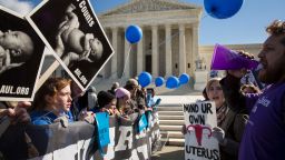 WASHINGTON, DC - MARCH 2: Pro-choice advocates (right) and anti-abortion advocates (left) rally outside of the Supreme Court, March 2, 2016 in Washington, DC. On Wednesday morning, the Supreme Court will hear oral arguments in the Whole Woman's Health v. Hellerstedt case, where the justices will consider a Texas law requiring that clinic doctors have admitting privileges at local hospitals and that clinics upgrade their facilities to standards similar to hospitals. (Drew Angerer/Getty Images)