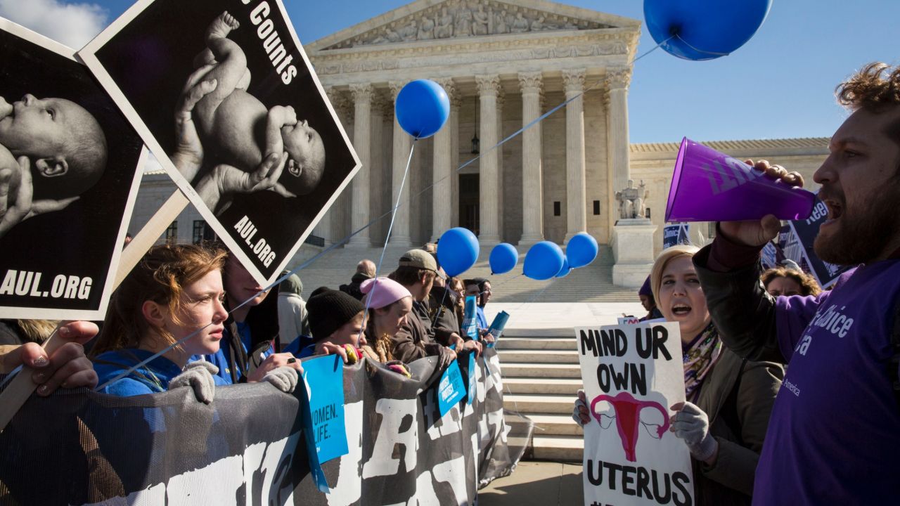 Anti-abortion, left, and abortion rights advocates face off this month outside the U.S. Supreme Court.