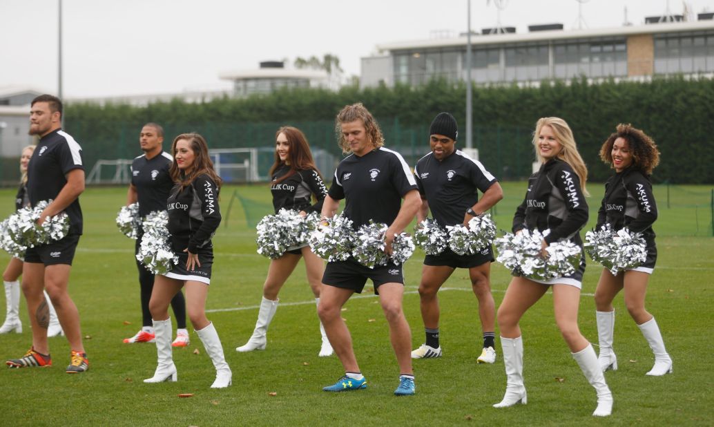 But the wing is as well known for his colorful antics -- here doing a spot of cheerleader -- as he is for his rugby.