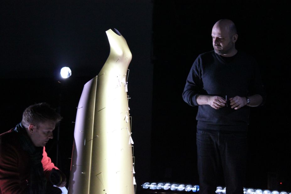 Made of gold, this floating dress expels Swarovski crystal "pollen" as it moves.