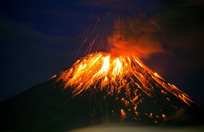 The Ecuadorian volcano Tungurahua spews lava and ash in Cahuaji, about 80 miles south of Quito, in February 2016. Authorities raised the alert level from yellow to orange after the volcano increased its activity and projected a column of ash 3 miles high.