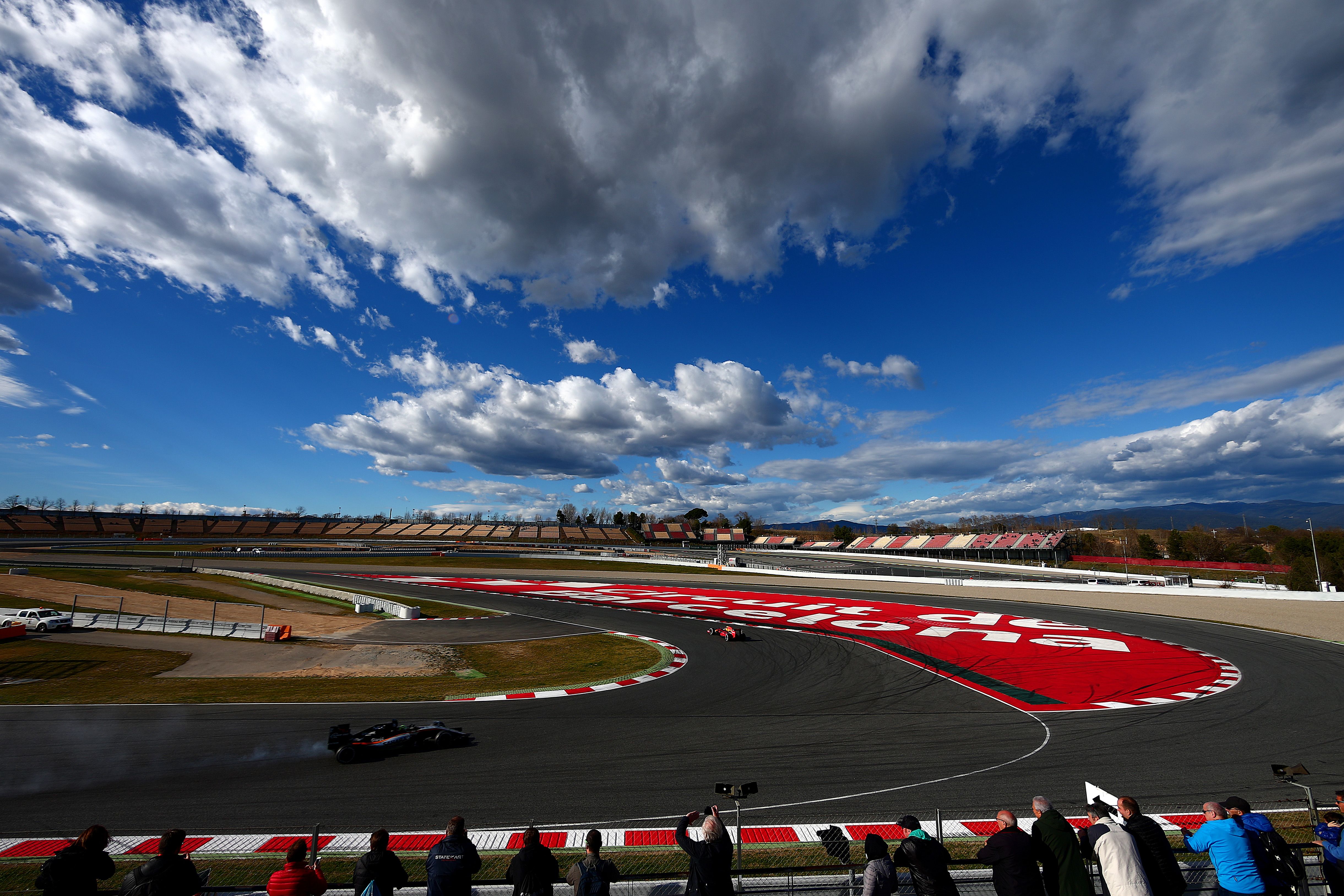 Nico Hulkenberg of Force India approaches the corner as Daniil Kvyat of Red Bull Racing exits smoothly during day three. 