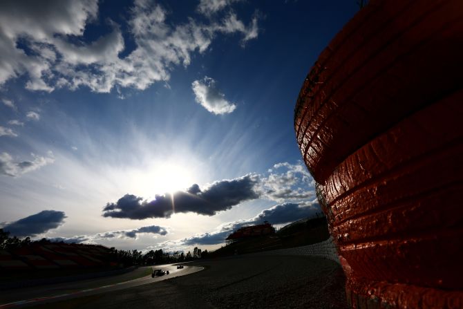 Sauber's Marcus Ericsson and McLaren's Jenson Button cruise around the Circuit de Catalunya on March 2. 