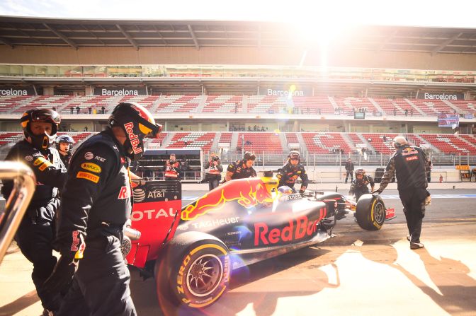 Daniel Ricciardo of Red Bull Racing is pushed back into the garage during day two of  testing.