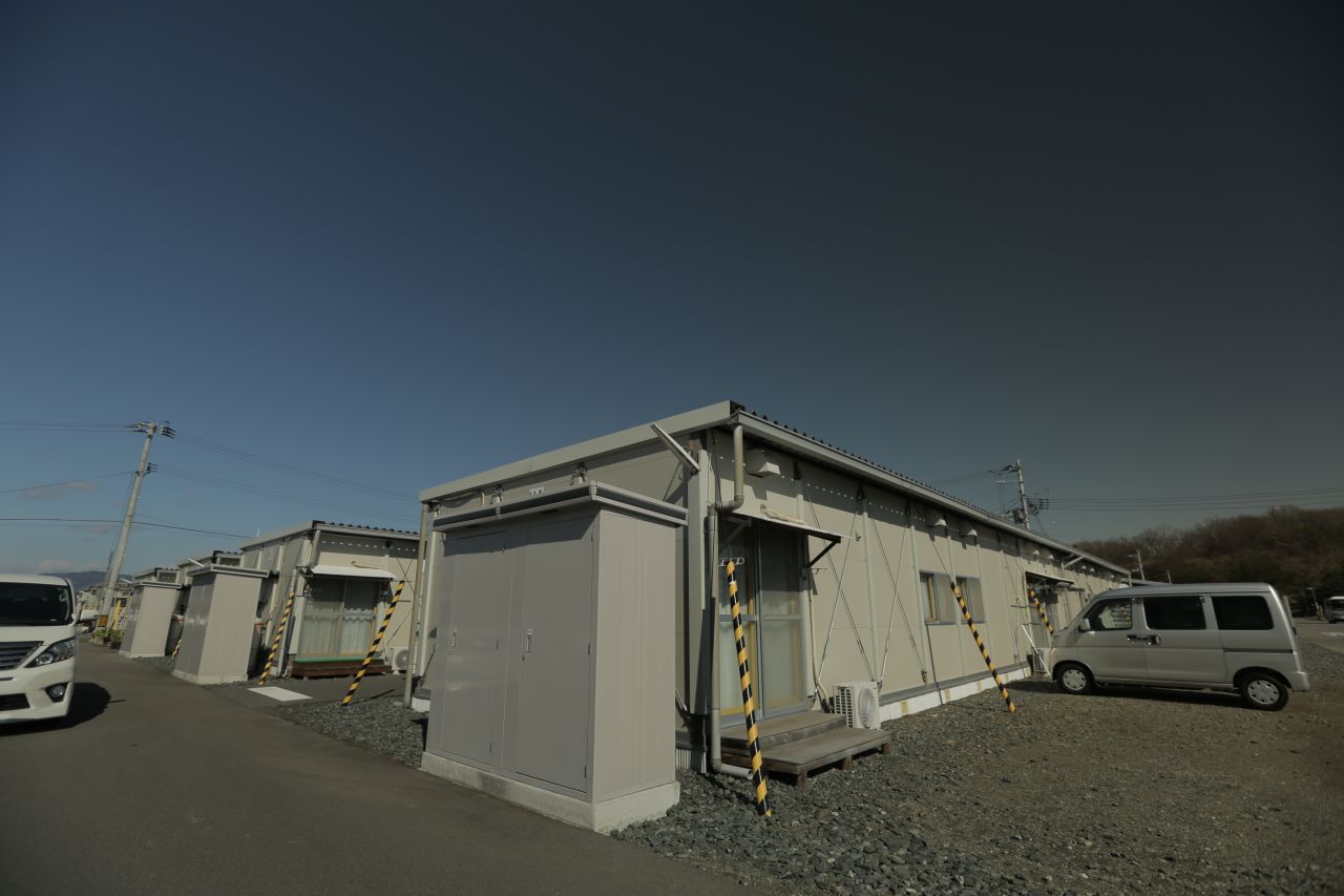 Outside the limits of the exclusion zone, many evacuees were housed in prefabricated metal buildings. Each has two 7 meter square rooms, a tiny kitchen and a bathroom.