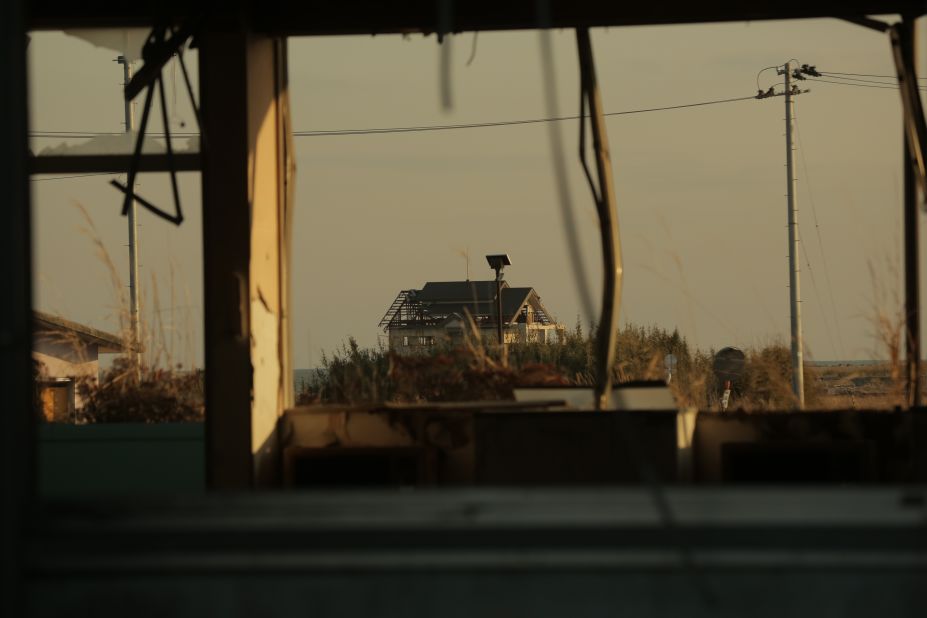 Destroyed buildings seen from inside an abandoned class room in Fukushima prefecture.