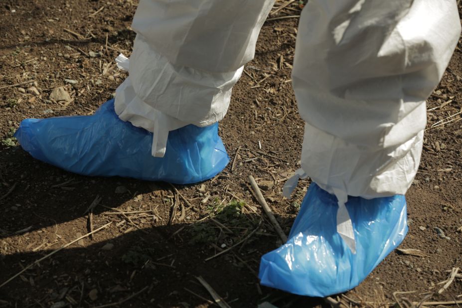 Workers and former residents have to wear protective gear while inside the exclusion zone.