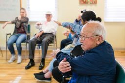 Toru Lura, stretches during the morning exercises at the WISE & Healthy Aging adult day service center for seniors with dementia in Santa Monica, California, in February 2016.